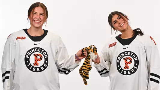 Stefanie Wallace and Daniella Calabrese hold a stuffed tiger