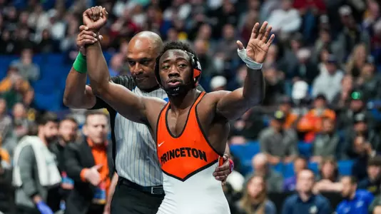 Quincy Monday third-place match arm-raise photo