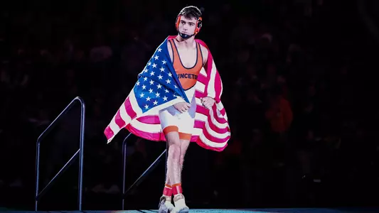 Patrick Glory draped in U.S. flag entering mat at NCAA Championships 2023