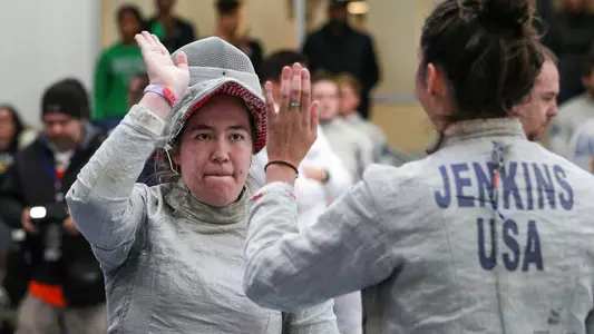 Chloe Fox-Gitomer high-fives Ryan Jenkins