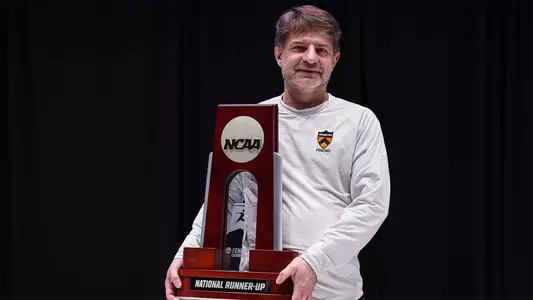 zoltan dudas with 2023 ncaa national runner-up trophy