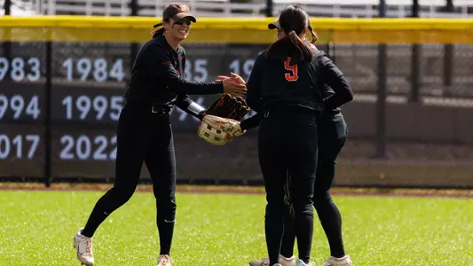 Softball outfielders greeting