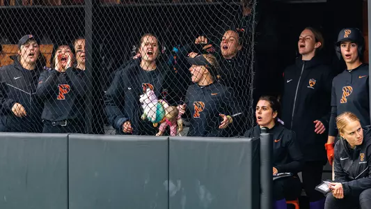 softball team cheers from the dugout