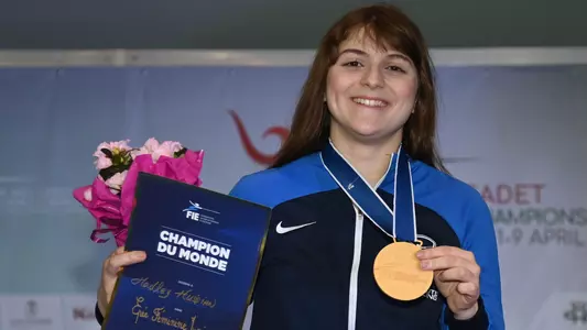 Hadley Husisian 2023 junior world championship photo with medal and certificate
