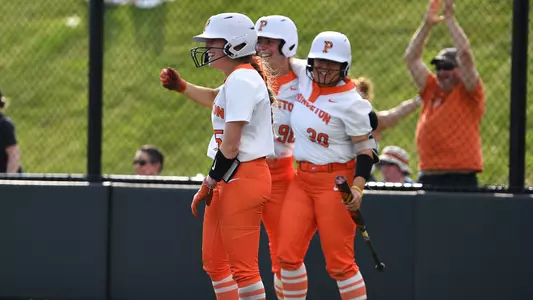 Grace Jackson, Julia Dumais and Allison Ha celebrate during Princeton's 8-4 ILT win over Columbia