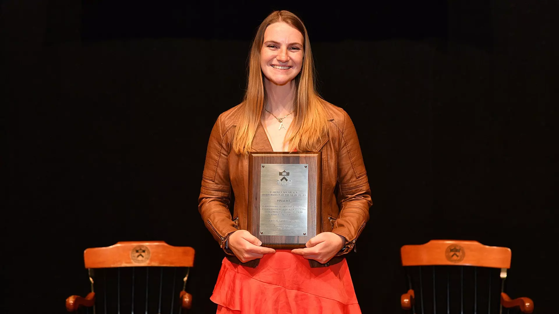 Alexis laudenslager poses with award