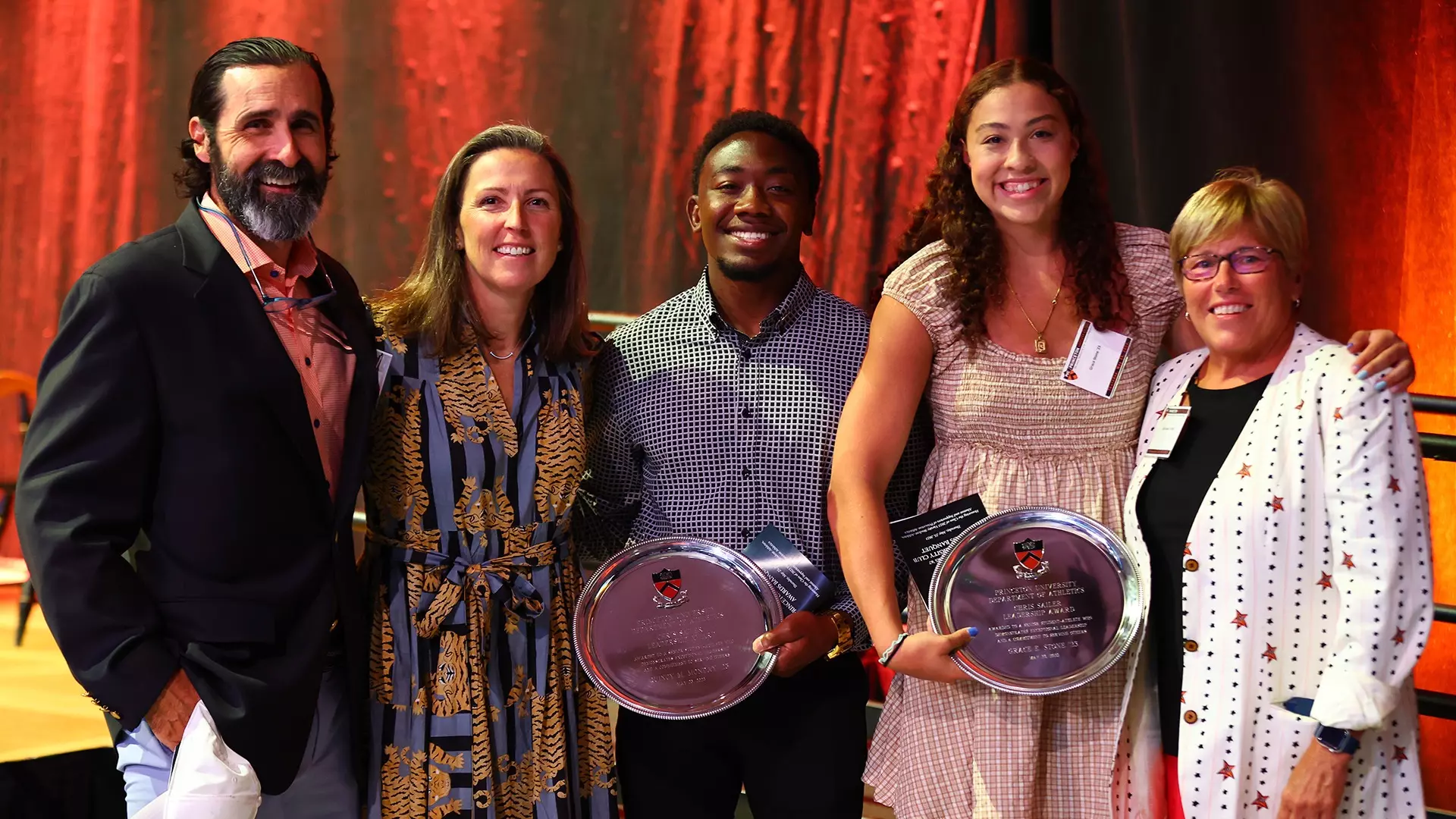 Quincy Monday, Grace Stone and Chris Sailer with banquet attendees