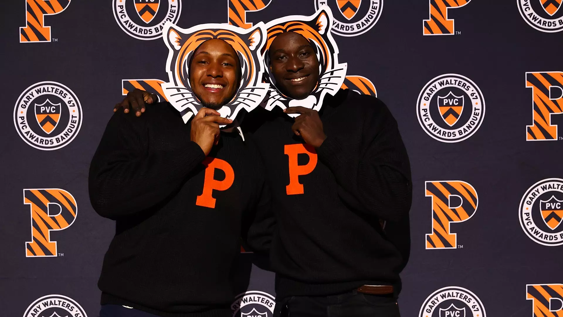 banquet attendees posed with Tiger logo