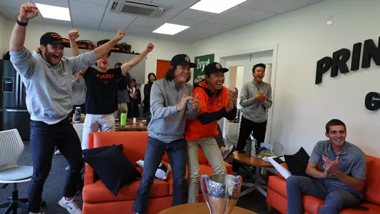 members of the Princeton men's golf team react to the team's announcement on the NCAA regional selection show