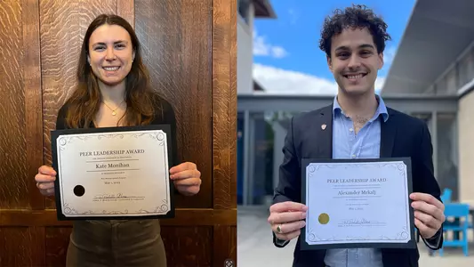 Kate Monihan-Alex Mrkalj posed photo with awards
