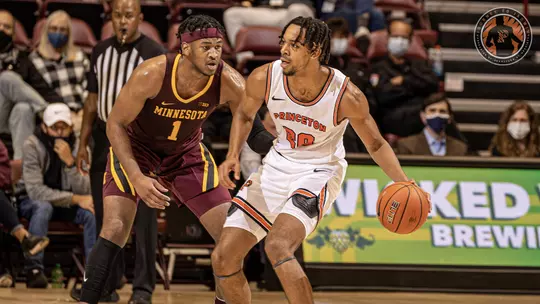 Tosan Evbuomwan backs down a defender against Minnesota