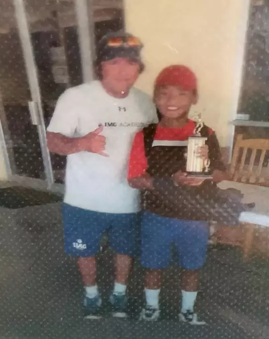 Fnu Nidunjianzan with IMG Academy coach.