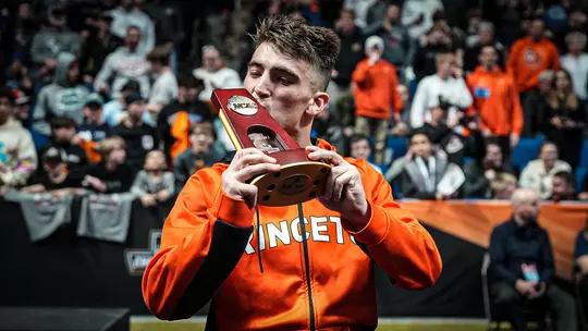 Pat Glory Kisses NCAA Trophy