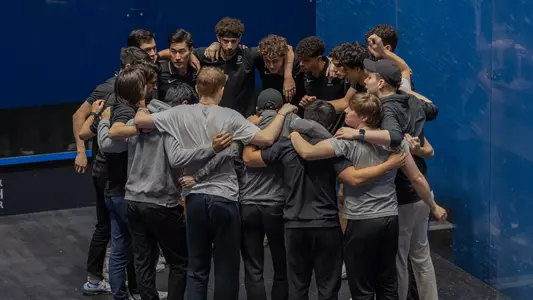 men's squash huddle photo
