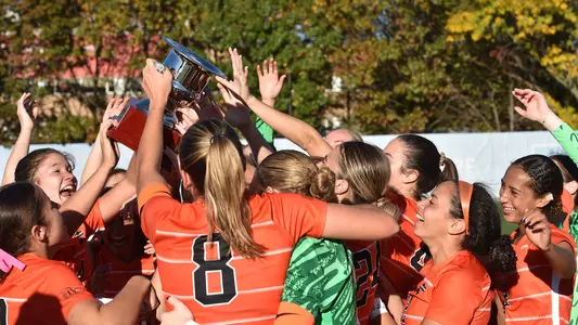 women's soccer trophy celebration photo