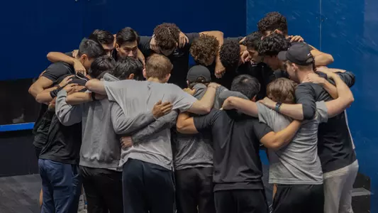 men's squash huddle photo