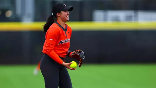 sonia Zhang smiles in candid photo holding softball