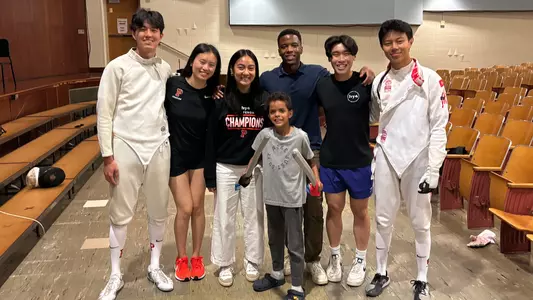 fencers with elementary school student
