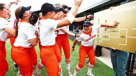 Brielle wright celebrates with team at bracket board