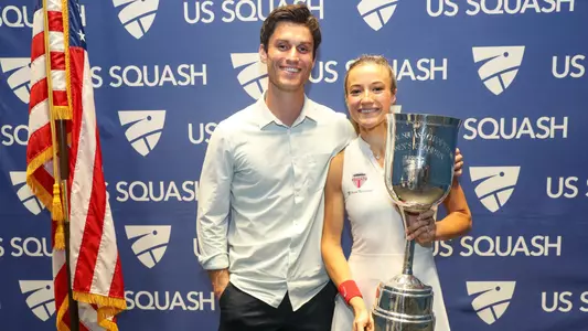 olivia weaver '18 with husband bobby weaver '16 and us squash national championship trophy