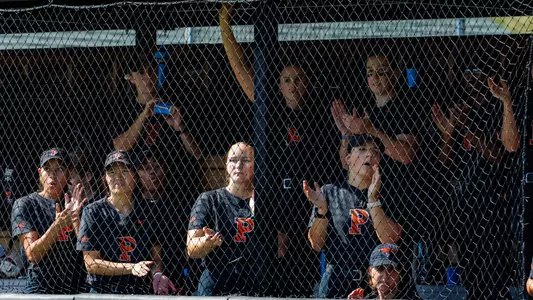 softball players in dugout