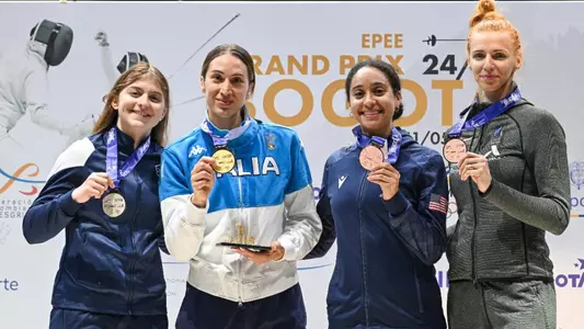 posed photo of four fencing medalists husisian left nixon third from left