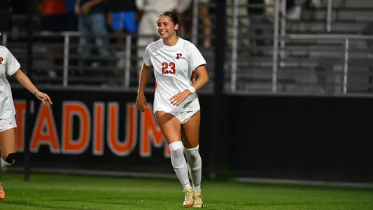 Summer Pierson smiling candid on field