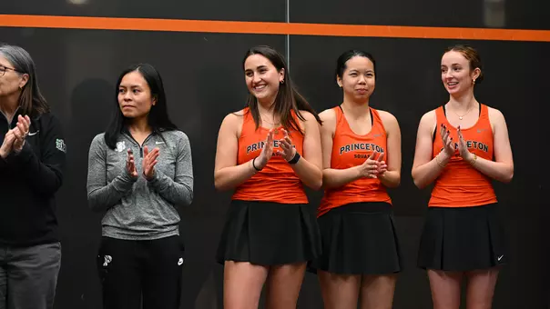 photo of women's squash players/coaches during introductions