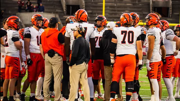 Football gathers on the field at Harvard Stadium in 2026