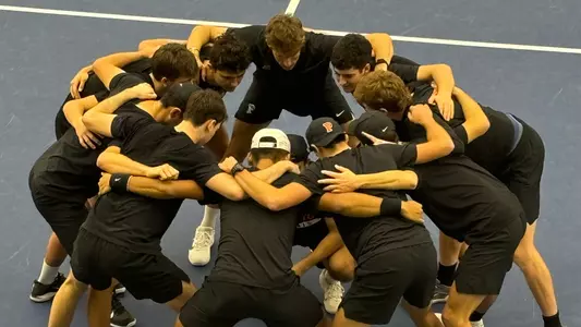 Men's Tennis Team huddle