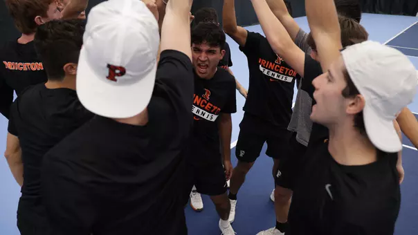 Men's tennis breaking huddle