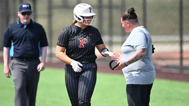 Jessica Phelps smiles with assistant coach Alyssa Davis