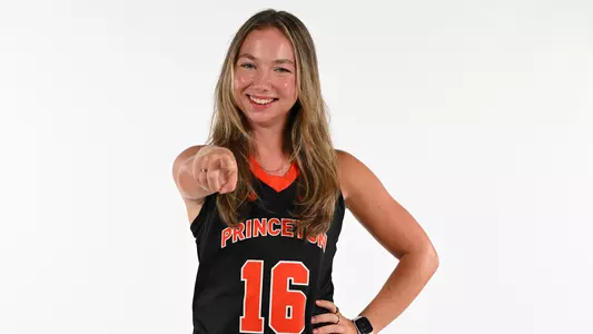 Ella Cashman pointing in front of white screen