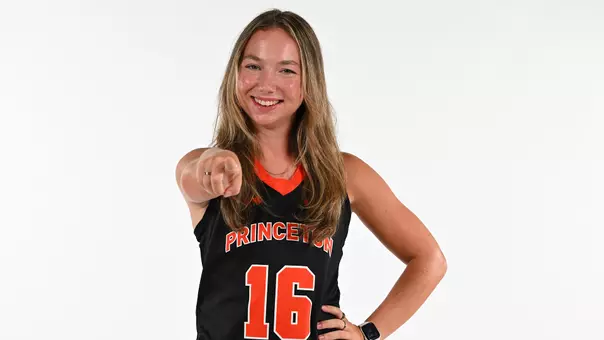 Ella Cashman pointing in front of white screen
