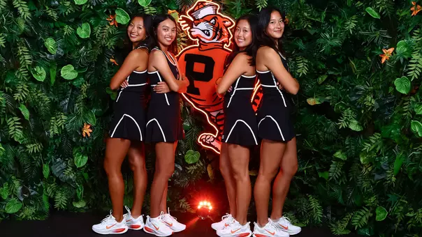 Four women's tennis players jungle set