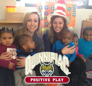 Women's Volleyball Spends Time Reading to Children at Montessori Preschool in New Haven Image