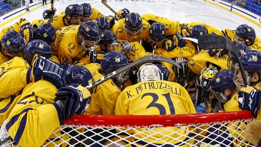 men's hockey pre-game huddle