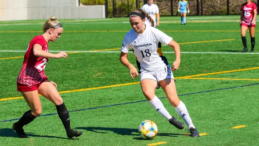 Olivia Scott dribbles past a Rider defender