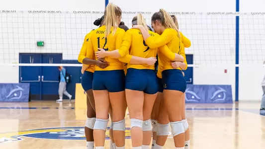 Volleyball Players Huddle Up Pregame vs. Manhattan