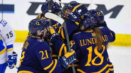 Women's Ice Hockey celebrates after a goal