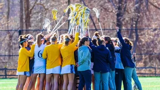Women's Lacrosse Team Huddle vs. Siena