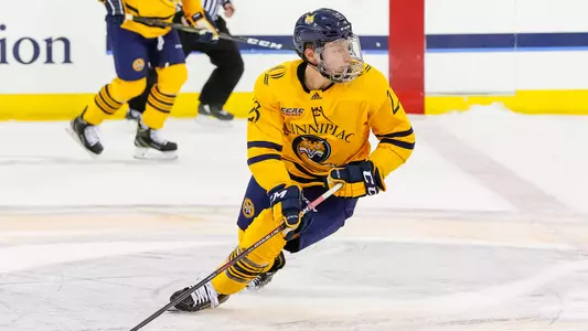 Zach Metsa Skates with Puck at Center Ice