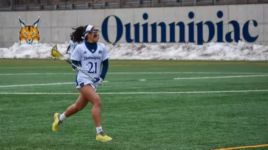 Gabby Beckett with QU wall background