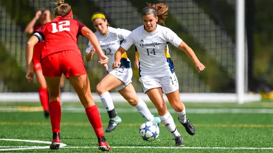 Lauren Triglione dribbles past defender