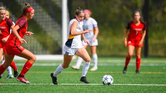 Emily Loney dribbles past Fairfield midfielder.