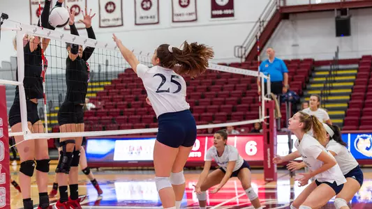 Aryanah Diaz Spikes the Ball Over the Net