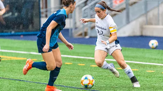 Goldring dribbles past URI defender