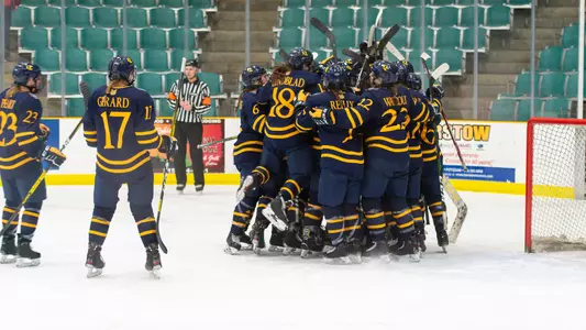 Team huddle after win at Clarkson
