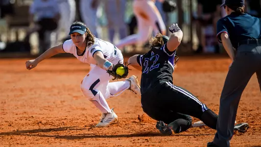 Rachel Marchuk reaches to tag runner