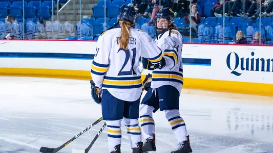 Kenzie Prater, Sarah-Eve Coutu-Godbout skate up during starting lineup